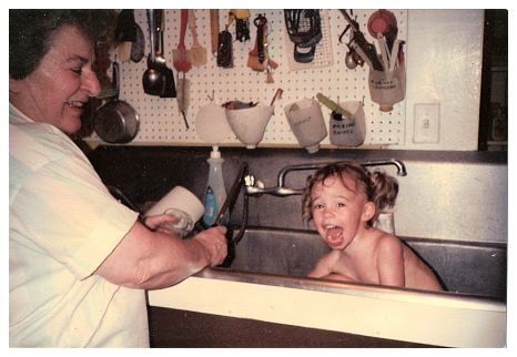 1988 - Bianca, with granddaughter Katie receiving her bath at the WLP bath house.jpg